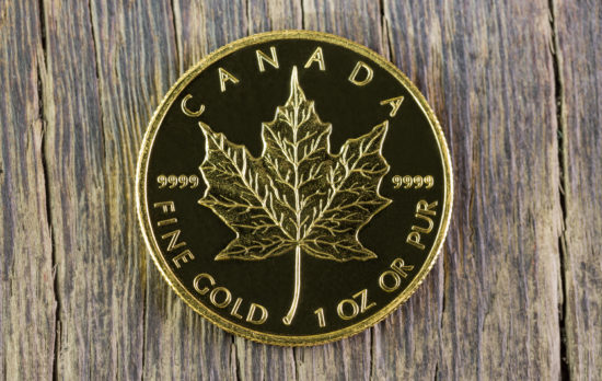 A Gold Canadian Maple Leaf coin.