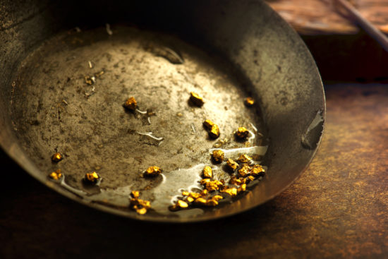 Gold in a gold pan.