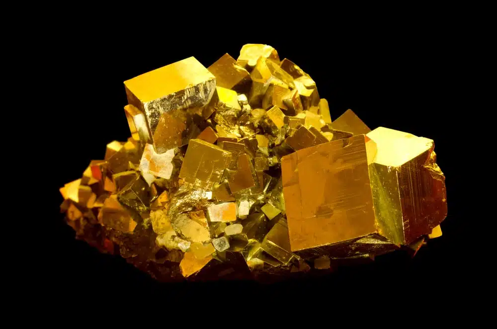 Pieces of pyrite or fool's gold on a black background.