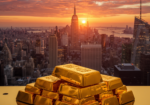 Gold bullion bars stacked against a New York City skyline at sunset, representing the precious metals market outlook amid inflation concerns and Federal Reserve uncertainty
