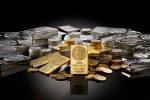 Gold and silver bars and coins including a 10 troy oz fine gold bullion bar surrounded by silver ingots