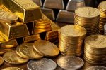 Gold and silver bars stacked beside mixed coins on wooden surface, representing precious metals market volatility