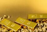 Gold,Nuggets,And,Bars,On,Shiny,Background,,Closeup
