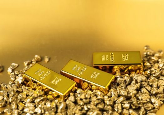 Gold,Nuggets,And,Bars,On,Shiny,Background,,Closeup