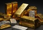 Gold and silver bullion bars illustrating the gold market outlook ahead of the Federal Reserve's upcoming interest-rate decision.